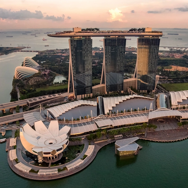 Aerial view of Marina Bay Sands with its three towers and rooftop infinity pool in Singapore.