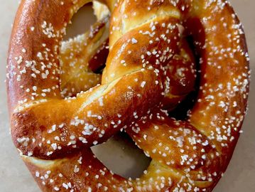 Soft pretzel topped with coarse salt.