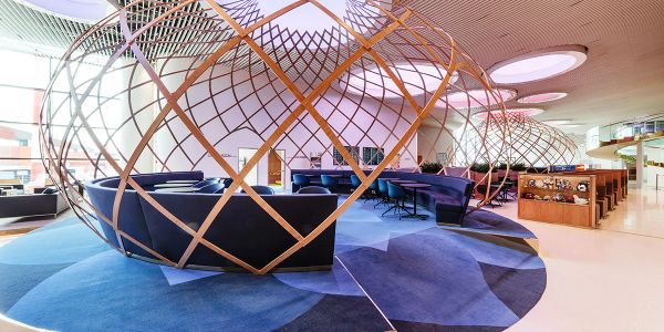 Modern seating pods inside a spacious lounge.