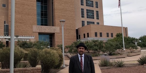 Barry Klopfer, a criminal defense attorney, stands in front of the U.S. Federal District Courthouse.