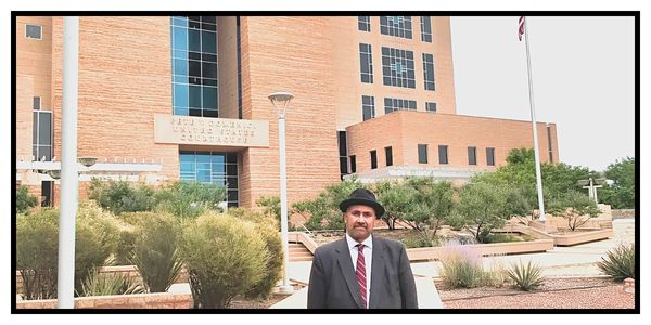 Criminal defense lawyer Barry Klopfer standing in front of the Albuquerque U.S. District Courthouse.