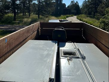 One of DougCoJunk's trailers filled with single item pickups. Two fridges and riding lawn mower