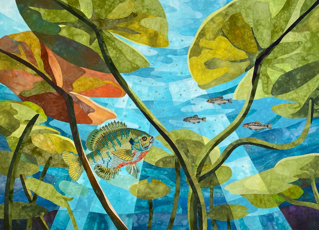 Fabric collage of a Bluegill Sunfish and three minnows swimming among lily pad leaves and stems, tur