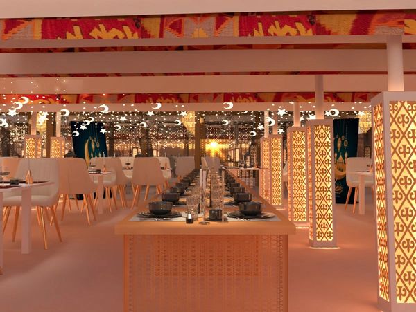 Luxurious, warmly lit dining area with elegant table settings and ornate lanterns.