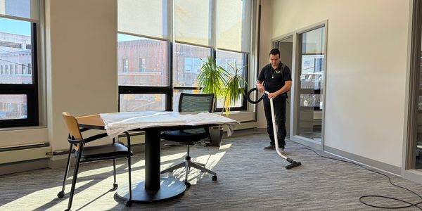 Aguilar Pro technician vacuuming office in Kalamazoo, MI.