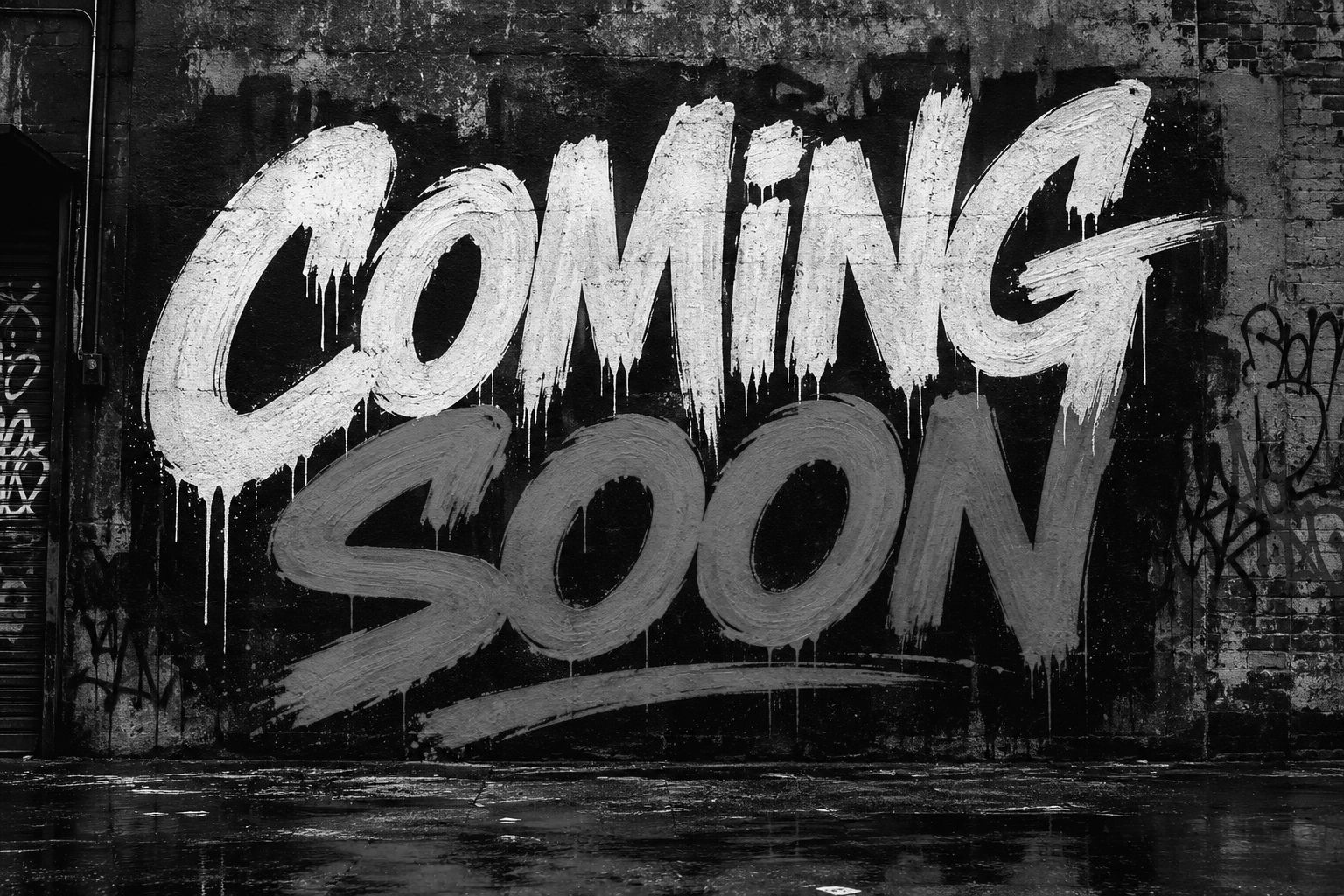 Black and white graffiti on a wall says 'COMING SOON'.