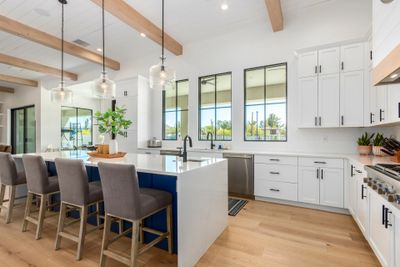 Luxury Scottsdale kitchen remodel featuring custom cabinetry, large island and elegant modern finishes