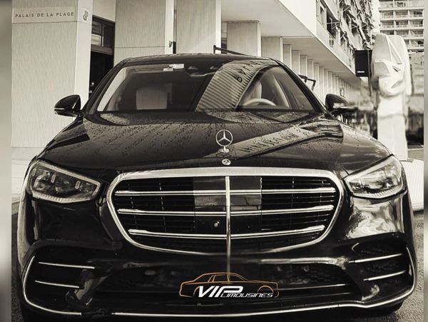 Front view of a black Mercedes-Benz luxury car.