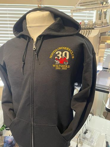 A black jacket with a bold printed design.