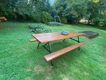 Outdoor wood table dinner finished with varnish