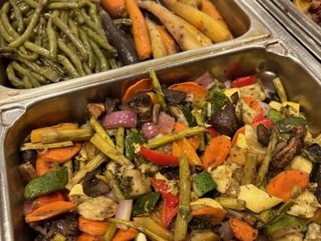 Mixed roasted vegetables in a serving tray.