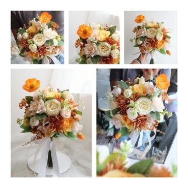 Elegant bouquet of orange, cream, and peach flowers with green leaves and white ribbons.