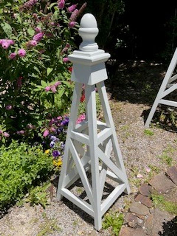 Small wooden garden obelisk with x-bracing