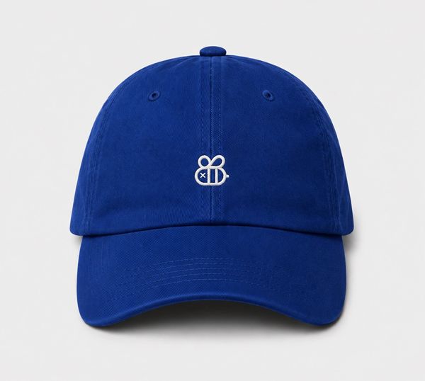 Blue baseball cap with a small white embroidered bee logo at the front.