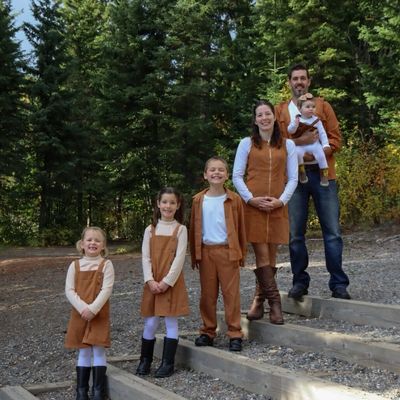 Family of six in matching outfits in the woods