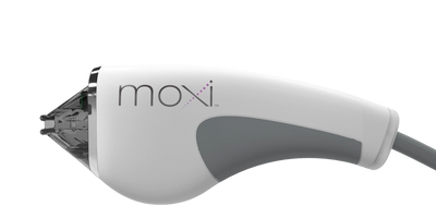 Close-up of a white and gray handheld device labeled 'moxi'.