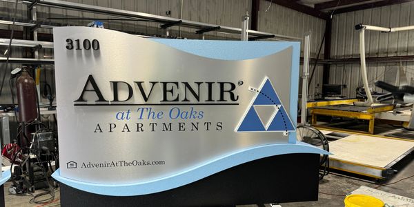A monument sign being manufactured in a shop waiting to be delivered