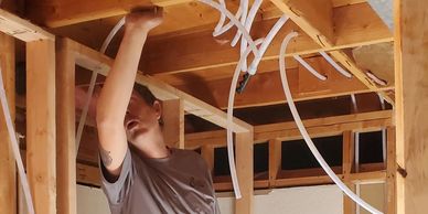 running water supply lines through wood framing.