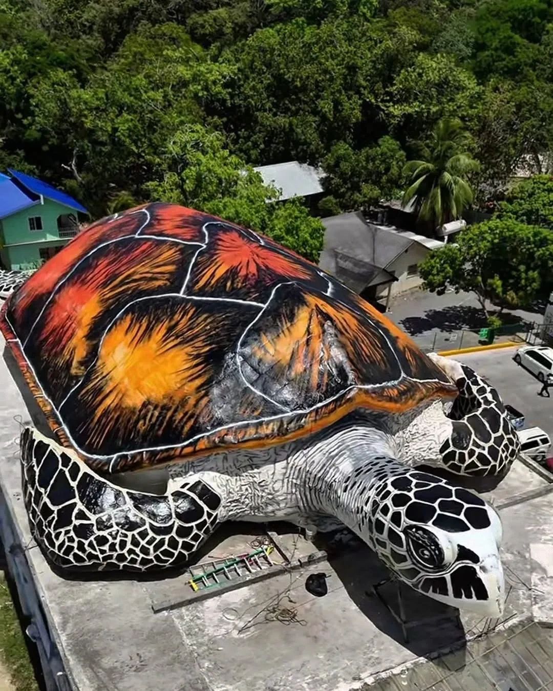 Iconic Turtle Building in West End, Roatán – home of Island Massage School's student clinic.