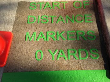 Ground signs distance markers made from preformed thermoplasic on concrete by Surface Signs of NY