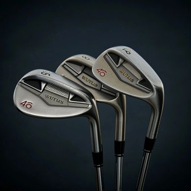 Three silver WUTILS golf irons with different loft angles on a dark background.