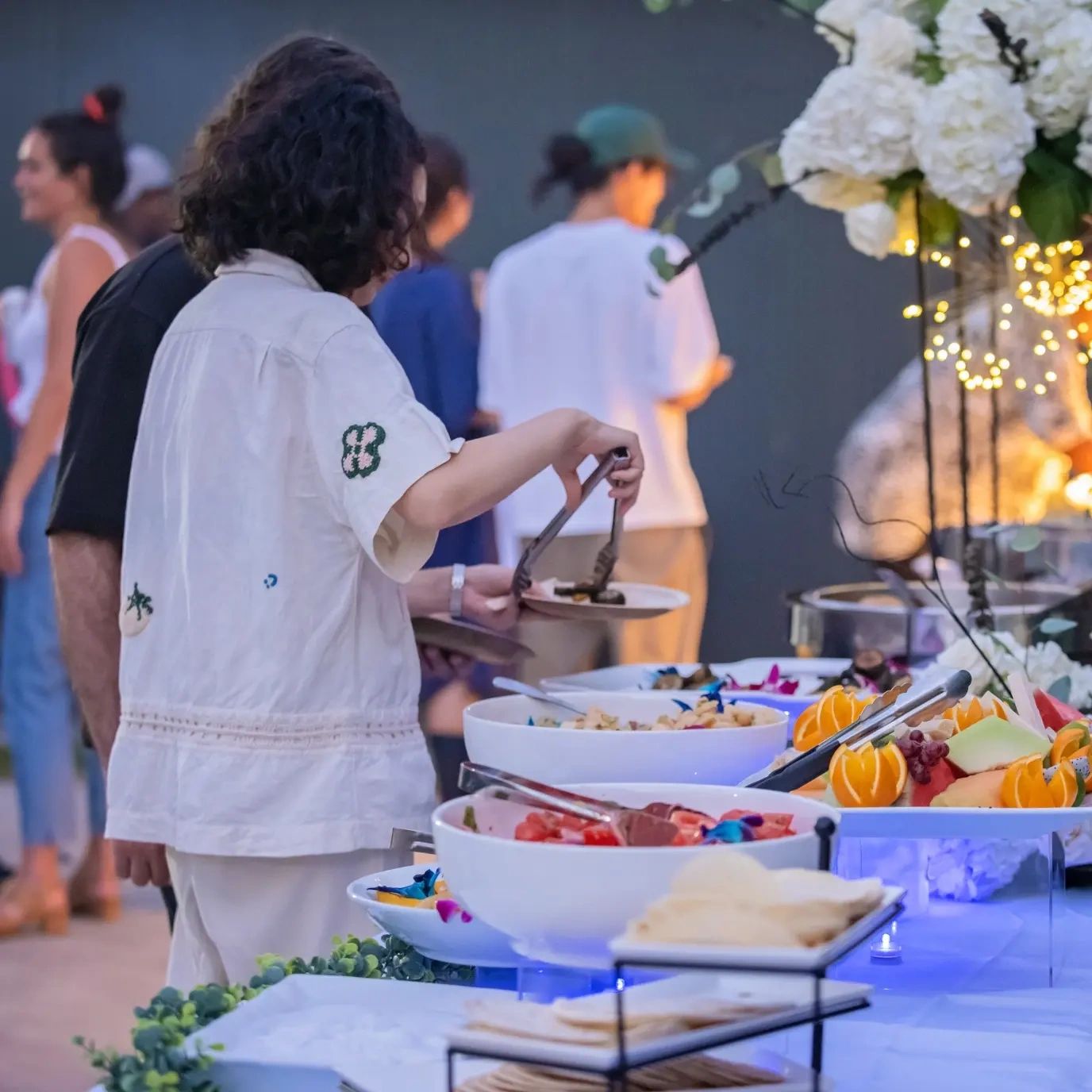 Indulge in Clarendon Cuisine's: a vibrant table spread of fresh tropical fruits.