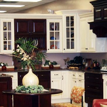 A kitchen with white cabinets