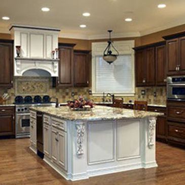 A kitchen with white and brown cabinets