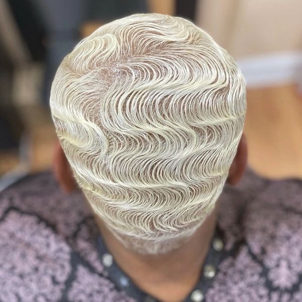 Intricately styled platinum blonde finger waves.