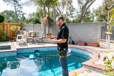 A person is inspecting the pool area 