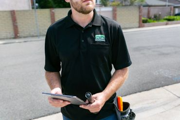 A person holding a tab and a torch light