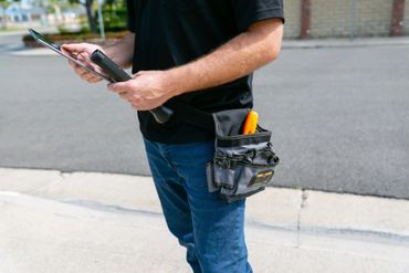 A person holding tab and equipment