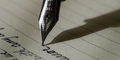 A fountain pen writing on paper