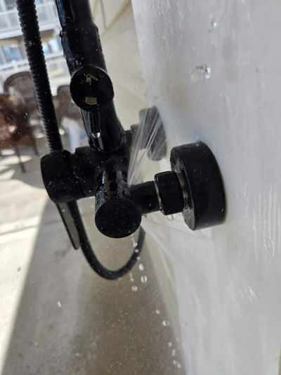 Leaking outdoor shower faucet spigot that needs repair