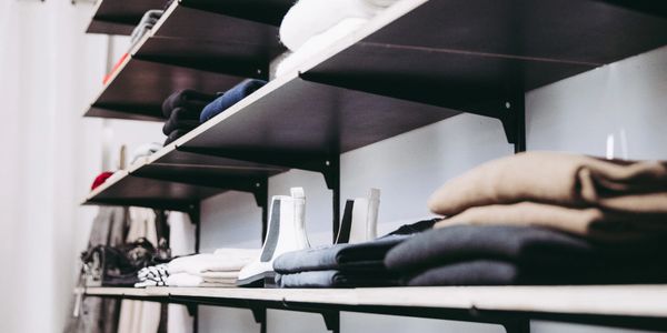 shelves with clothing on them