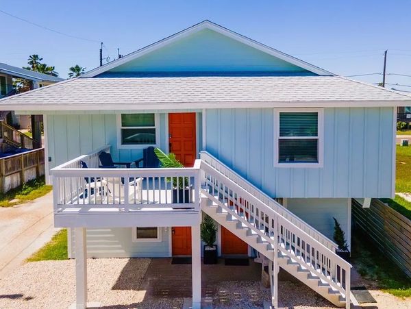 Adorable cottage-updated, turnkey, STR-zoned, and just blocks from the beach and island favorites.