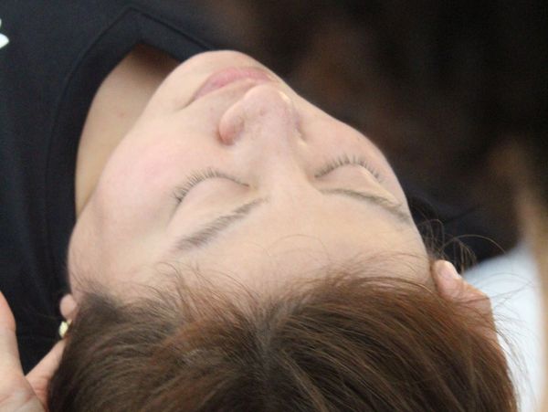 Client relaxing after craniosacral therapy promoting balance at Wholly Spirit Hands Sugar Land.