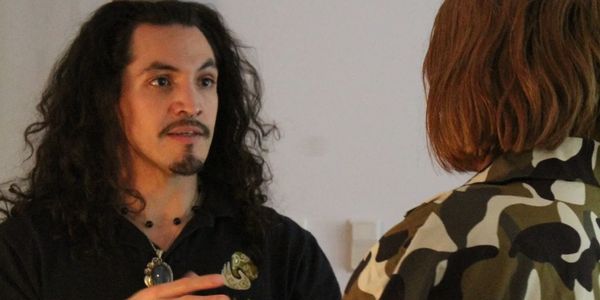 Trusted therapist with happy client after energy balancing massage treatment in Sugar Land, TX.