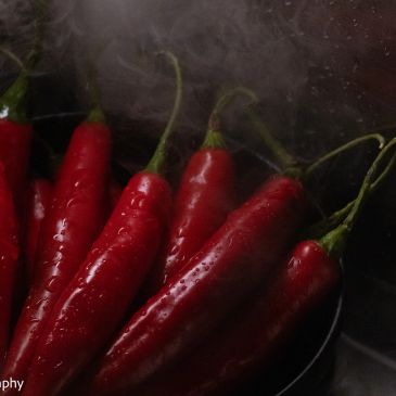 Red chillis photographed for commercial product photography by Bona Photography Sydney.