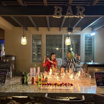 Our in house bartenders dressed in beetlejuice costumes for an 80’s party 