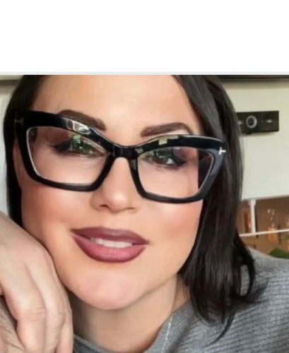 Woman with dark hair wearing large black glasses and mauve lipstick.