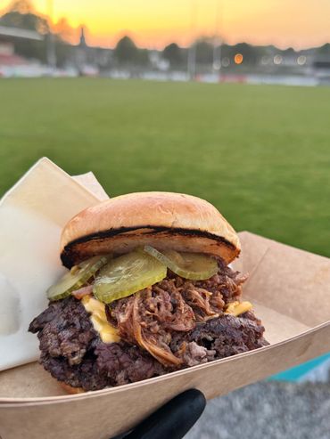 Home made smash burger from the BBQ by Ad Hoc Catering for outdoor events in Devon and Cornwall
