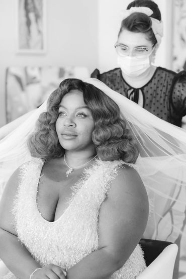 Anna adjusting a veil after fitting a wig, wig has been designed with classic vintage waves