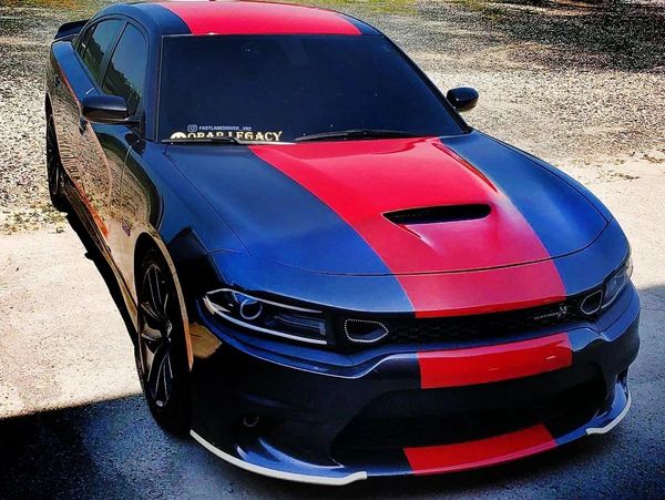 A truck with a vinyl vehicle wrap on the cab.