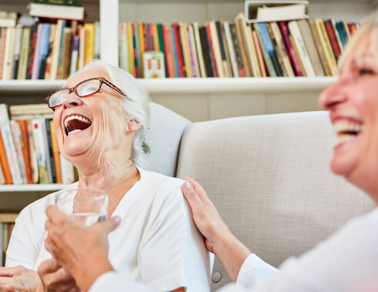 Mount Vernon Companion Care staff laughing with an elderly woman while providing care and friendship