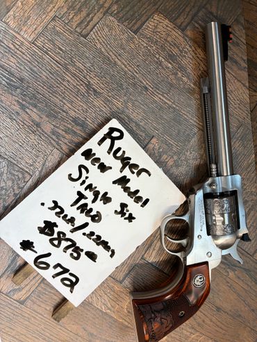 Ruger New Model Single Six revolver with a note displaying its details.
