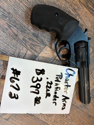 Charter Arms Pathfinder 22LR revolver with handwritten details on paper.