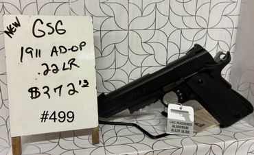 New GSG 1911 .22LR pistol priced at $372.12 with a handwritten sign.
