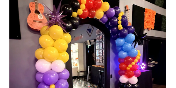 Colorful balloon arch displayed at event in Lewes, Delaware. Custom balloon arch, balloon centerpiec