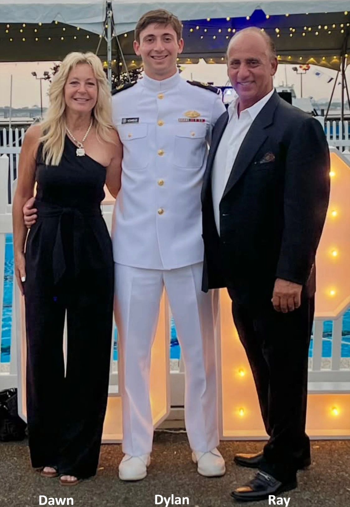 A proud Navy graduate with his parents.
